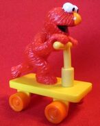 Elmo on a scooter