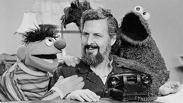 Ernie and Cookie Monster with Sesame Street co-creator Jon Stone; note the alternate phone prop on the table