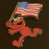 Elmo waving the American flag