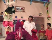 Telly attaches an ice cream mixer to his pogo stick in Elmo's Magic Cookbook.