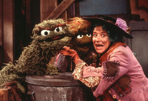  plays a variety of characters, including fish seller Trasha, in .