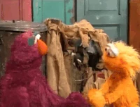 Zoe blows on a pinwheel in Sesame Street Episode 3970