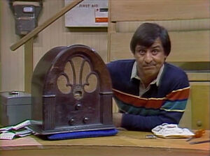 Luis is baffled by a talking cathedral-style old radio in .