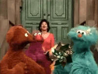 Rosita blows on a pinwheel in Sesame Street Episode 3970