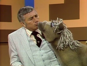 Richard giving his signature "Family Feud Kiss" to a horse.