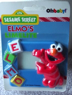 Elmo spelling his name with alphabet blocks