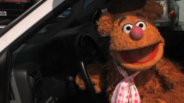 Fozzie driving through the "Bigger Burger" drive-thru in a Disney Xtreme Digital short