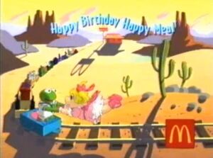 Cartoon Baby Kermit and Baby Piggy heading towards McDonald's in the commercial for .