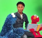 Pharrell with Cookie Monster and Elmo