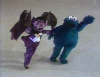 Xmasanother82.jpg (144 KB) The Count and Cookie Monster play "Snap the Whip."