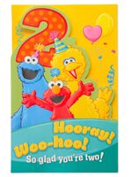 inside: "Elmo, Cookie and Big Bird are proud and happy, too, 'Cause they get to bring this wish to someone 2 - that's you!"