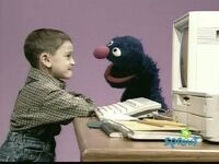 Grover watches Matthew type an X (First: Episode 3904)