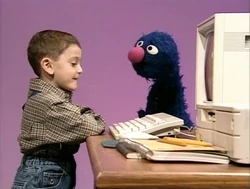 Grover watches Matthew type an X (First: Episode 3904)