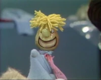 Pear Head waves hello.