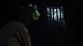 Muppets Most WantedKermit looks out at the moon in the gulag before falling asleep; Walter looks out at the same moon from the Muppets' train.