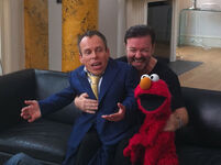 Gervais' office with Warwick Davis and Elmo