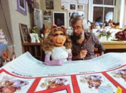 Miss Piggy and Art Director Michael K Frith look over the proofs for the calendar