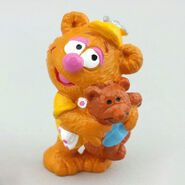 Baby Fozzie, hugging teddy bear