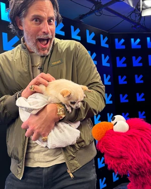 Manganiello and his pet dog Bubbles with Elmo