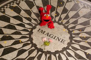 Elmo at NYC's "Strawberry Fields" tribute to John Lennon in Central Park (tweeted from @sesamejapan on September 21, 2017) [2]