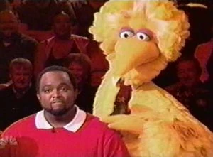 Big Bird sneaks up behind an unwary Lamar...