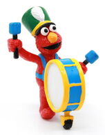 Elmo with a bass drum