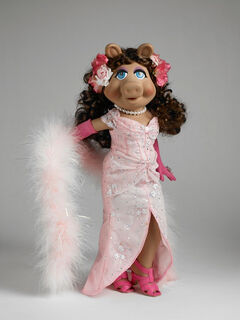 Divine Swine An embroidered and sequined pink shimmer dress; including gloves with sewn-on ring, hosiery, marabou boa and shoes. Outfit, wig and hair trim sold separately for 16" Miss Piggy Basic.