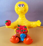 Big Bird with blue ribbon apples