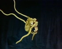 Scooter severs the Jabberwock's head in The Muppet Show episode 506