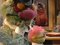 Chairman Blodgett has a cigar in the Muppet Meeting Film, "Think Bigger."