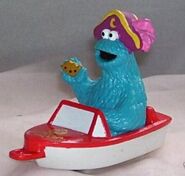 Cookie Monster as a pirate in a boat