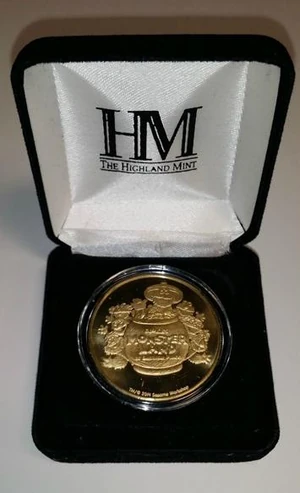 The coin displayed in its case