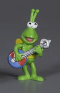 A green Twiddlebug with a bottlecap banjo