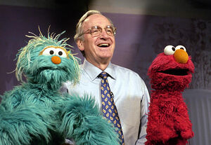 Senator Tom Harkin of Iowa with Elmo and Rosita.