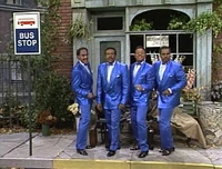 "Standing at the Bus Stop Sign"