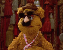 Fozzie Bear wears "Groucho glasses" on stage in The Muppet Movie