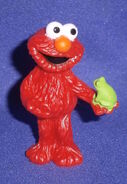 Elmo with a frog