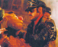 The Muppet MovieBiker grappling with Fozzie Bear