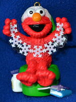 2002 "From Elmo with Love" Elmo with snowflake garland