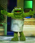 Oscar made his debut as a walk-around in Sesame Street Live in 2017, designed by Animax. Unlike the regular walk-around, this version cannot crouch down while inside the can, nor does he wear the lid on his head. He also appears in a different trash can.