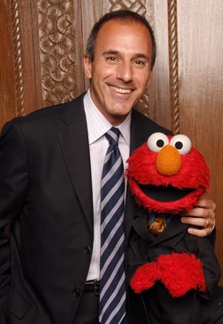 Lauer with Elmo at the 2006 Sesame Workshop Gala.