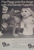 Statler, Waldorf and Fozzie heads with the large Kermit and Piggy dolls.