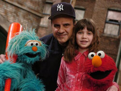 Joe Torre with Rosita, daughter Andrea, and Elmo