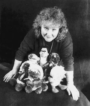 Specht with a group of Sesame Street toys in 1987