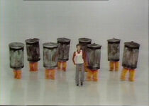 Julie dances with several trashcans in the opening sequence.