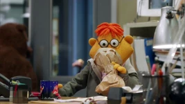 Scooter hyperventilates into a paper bag on The Muppets "Walk the Swine"