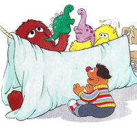 Big Bird and Snuffy play with dinosaur puppets and put on a puppet show in the book Best Friends.