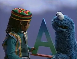 Cookie Monster and Jawhara discuss A (First: Episode 3234)