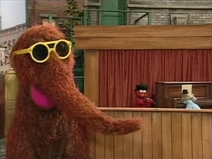 "Big Snuffy and the Alphatones" perform "