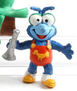 Baby Gonzo, holding toy trumpet